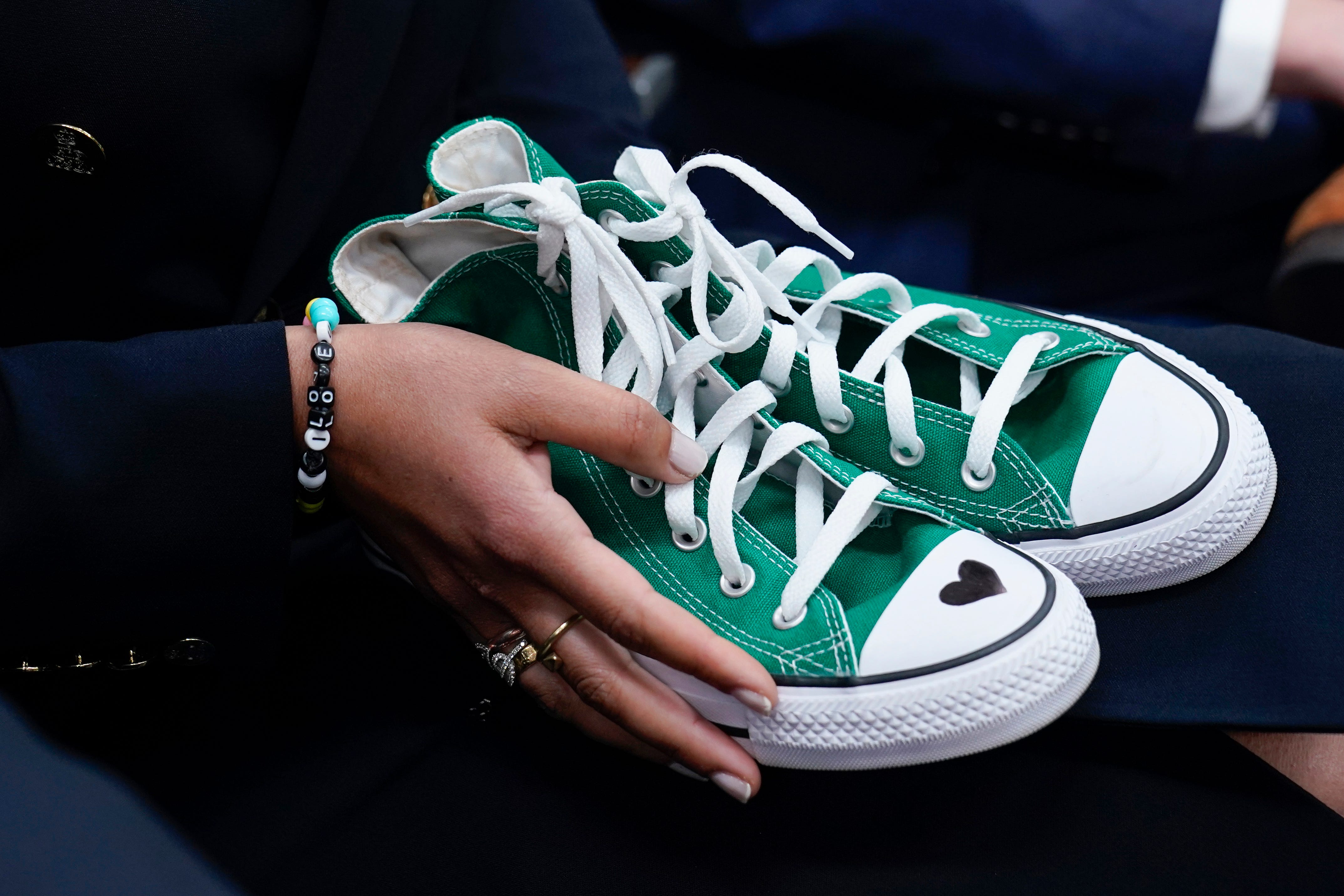 Camila Alves McConaughey holds green Converse shoes similar to those worn by shooting victim Maite Rodriguez as her husband, actor and Uvalde native Matthew McConaughey, makes a plea for gun safety legislation June 7 at the White House.
