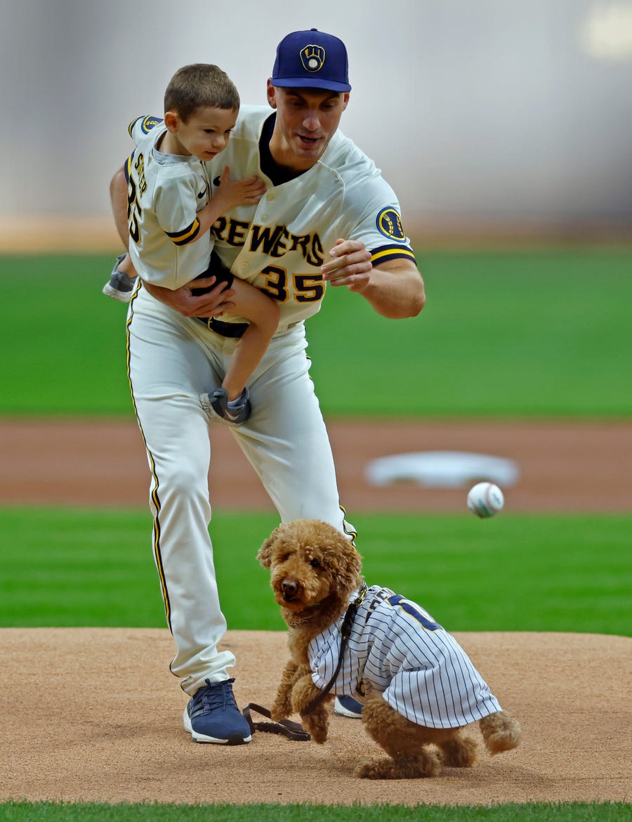 June 7, 2022:  Milwaukee Brewers pitcher Brent Suter throws out a first pitch for his dog on Bark at the Park night prior to the game against the Philadelphia Phillies at American Family Field.