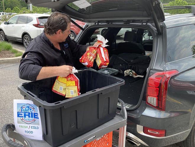 Lake Erie Food Rescue volunteer Michael Downey transports leftover food from the LECOM Senior Living Center to Community Shelter Services on Monday, June 6.