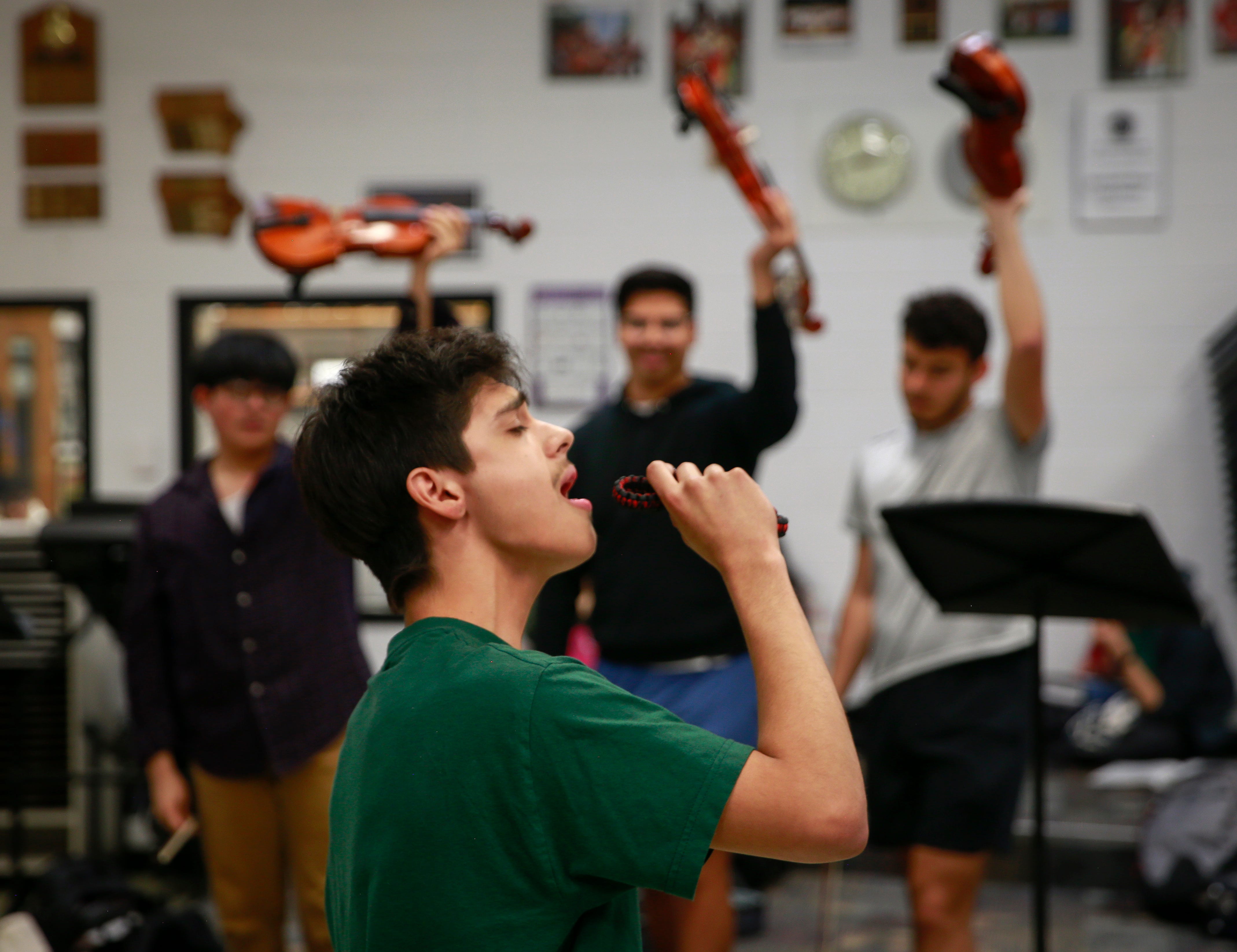 Denison High School senior Brian Ibarra, a member of the Mariachi Reyes del Oeste, the high school's top mariachi ensemble, sings during practice.