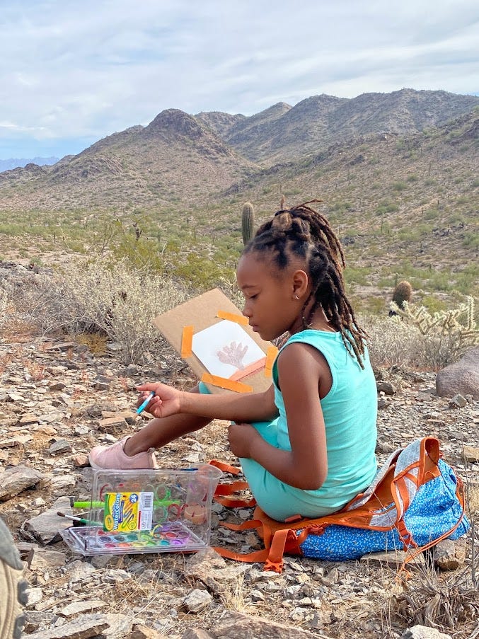 Samir Clinton, 8,  joined Atabey Outdoors for a 'Hike n Paint' adventure. As Atabey members hiked along the Freedom Trail in the Phoenix Mountain Preserve, they stopped to take in the views and paint the landscape with watercolors.