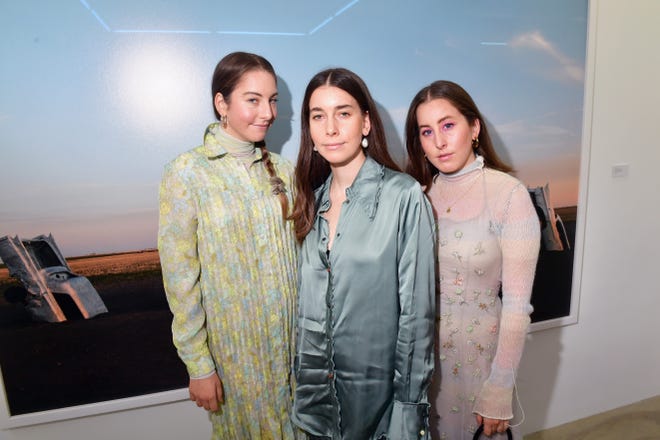 The rock trio Haim will return to Firefly Friday, Sept 23. 2022. The band of sisters (featuring Danielle Haim, Este Haim and Alana Haim) are pictured at an exhibition hosted by Acne Studios at Galerie Edouard Escougnou in Paris, Franceon on Sept. 28, 2018.