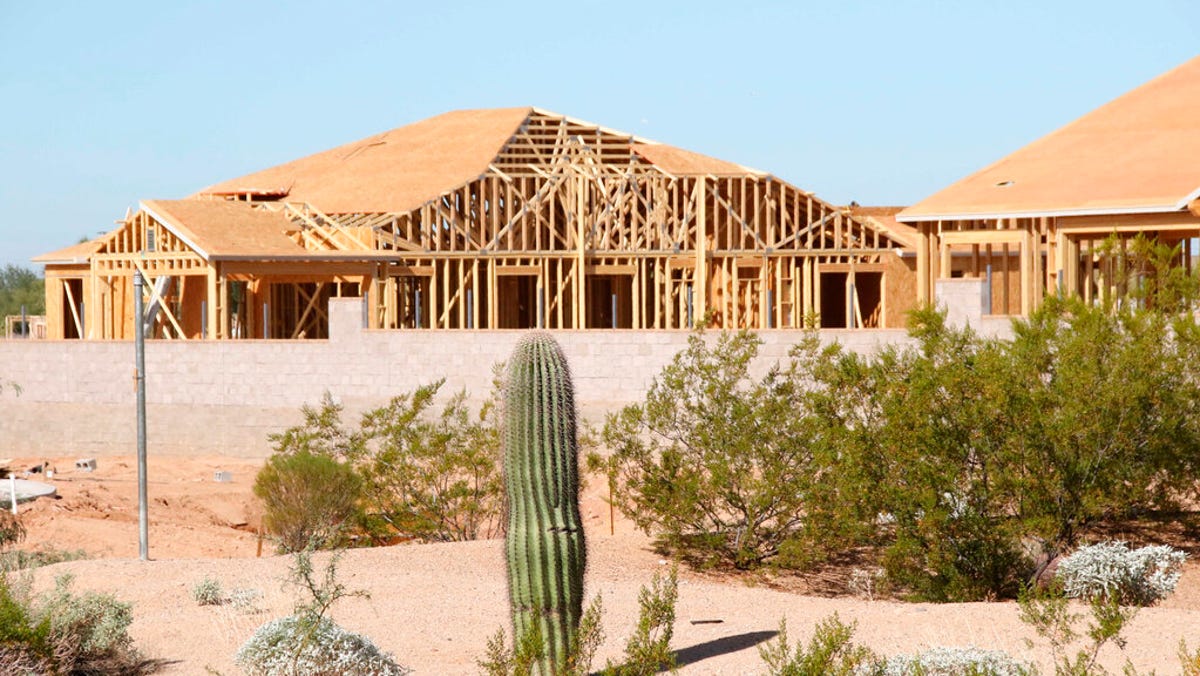 Construction of the new subdivision Monteluna, by Blanford Homes, is under way in Mesa, Arizona on Nov. 8, 2021. The metro Phoenix area is in the midst of a housing shortage that is pushing up home prices, and housing needed for the growing population is taking longer to build due to labor and material shortages.