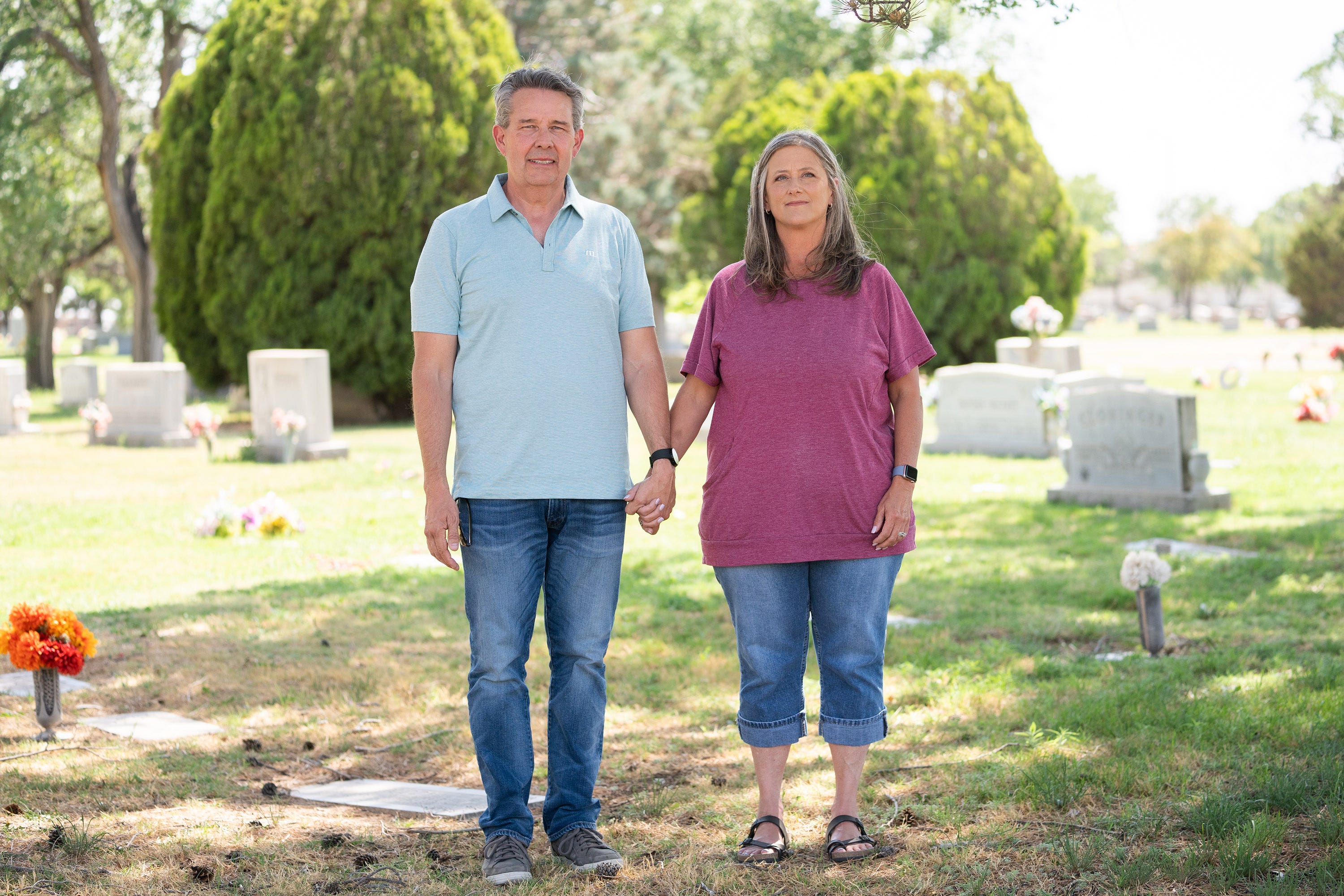 Nicole Carroll's brother, Chris, and his wife, Veronica, near where their mom, Judy, is buried. Veronica spent the most time with Judy toward the end.