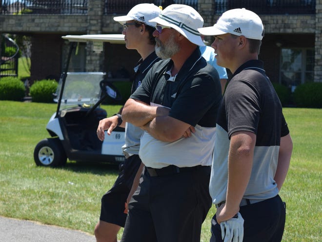 Bloomington South head boys golf coach Dustin Carver (middle) chats with junior Nick Bellush (right) and sophomore Landon "Happy" Gilmore by the 18th hole tee at Champions Pointe Golf Club during the IHSAA regional. (Seth Tow/Herald-Times)