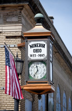 The faces of this historic clock tower outside Minerva Area Historical Society don't match, and the group is working to raise funds for a restoration. It is seen here Thursday, June 9, 2022, in the village.