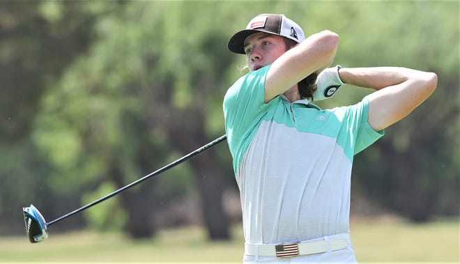 Abilene's Jett Long eyes his tee shot at No. 5. Long tied Abilene's Jett Voss for first in the ages 15-18 division with a 1-over-par 72.
