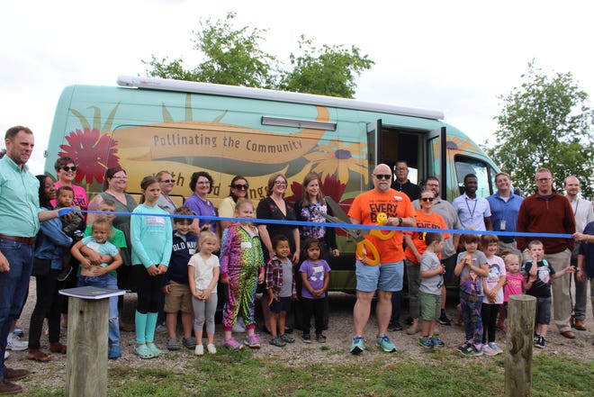 Community members gather to officially welcome "The Bee" mobile library to Ross County.