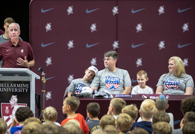 Seth Walsh 7, leukemia patient will join the Bellarmine University basketball team for the 2022-23 season. Bellarmine coach Scott Davenport, left, introduce Walsh and his family. From right, Michelle, (mother), Seth, Trevor, (father), and brother Max, age 9. June 9, 2022