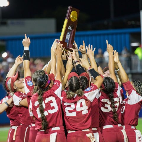 The Oklahoma Sooners hold up the national champion