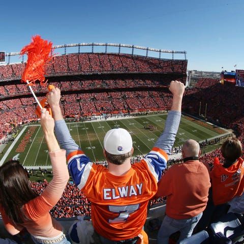 Denver Broncos fans cheer as the AFC championship 