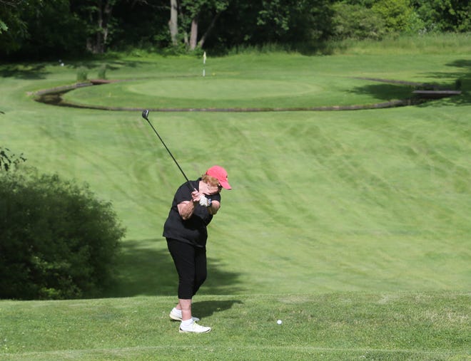 Jackie Ziarko tees off at Oakwood Country Club in Plain Township. The private club has a nine-hole, par 30 course, and no tee times.