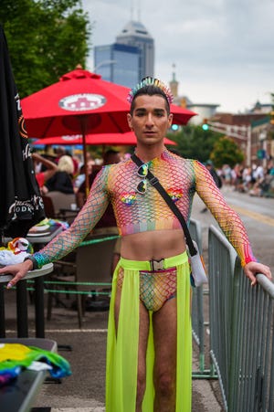 James Alexander, assistant general manager of Almost Famous, during the Indy Pride Parade on Saturday, June 11, 2022, along Mass Ave in Indianapolis."body positivity," Alexander said about the fashion of pride. "Feel free in your own skin."