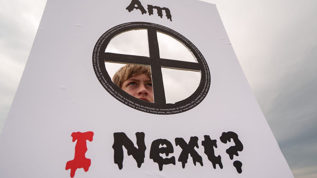June 11, 2022: Colin Lee, 12, of  Arlington VA, holds an "Am I Next?" sign at the March For Our Lives protest at the Washington Monument in Washington D.C.