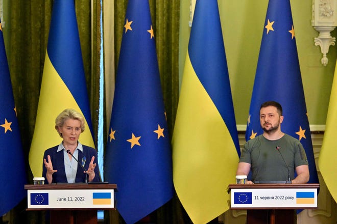 Ukrainian President Volodymyr Zelensky, right, and European Commission President Ursula von der Leyen speak following talks in Kyiv on Friday.