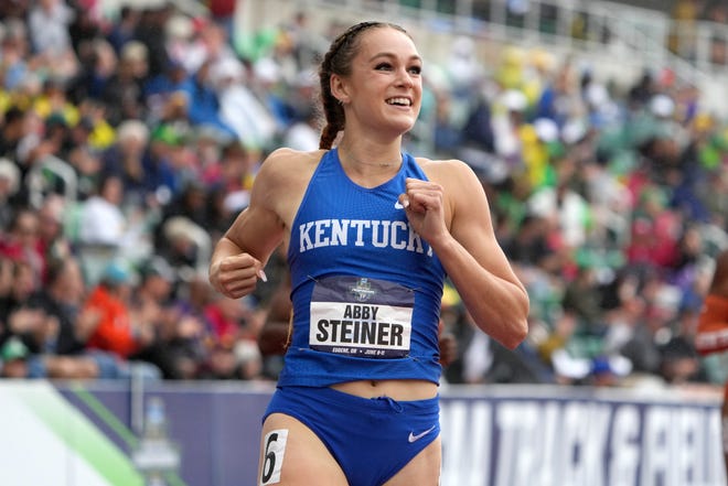 Abby Steiner of Kentucky celebrates after winning the women's 200m in a collegiate record 21.80 on Saturday.