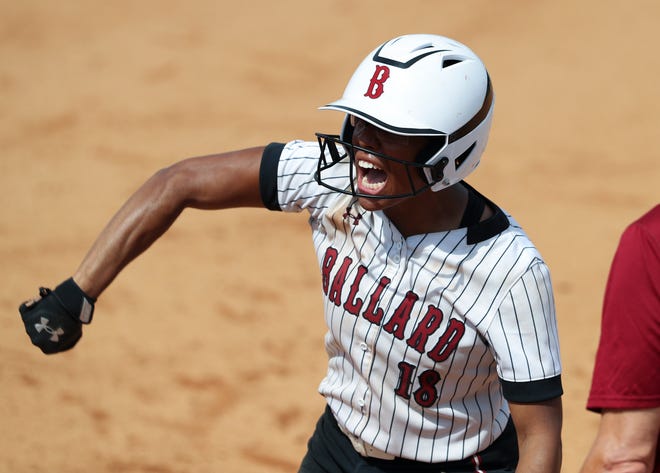 Ballard’s Imari Golden (18) celebrated after she knocked in teammate Macy McCoy (20) to score their third run against Lexington Catholic during the state softball championship in Lexington, Ky. on June 12, 2022.  Ballard won 3-2 to stay undefeated and complete the perfect season. 