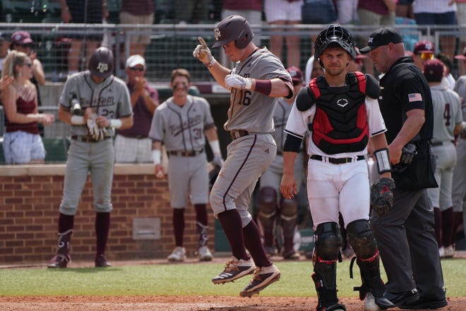 Jun 11, 2022; College Station, TX, USA;  Texas A&M infielder Ryan Targac (16) crosses home plate after hitting a home run to center field in the sixth inning against Louisville at Olsen Field at Blue Bell Park. Mandatory Credit: Chris Jones-USA TODAY Sports