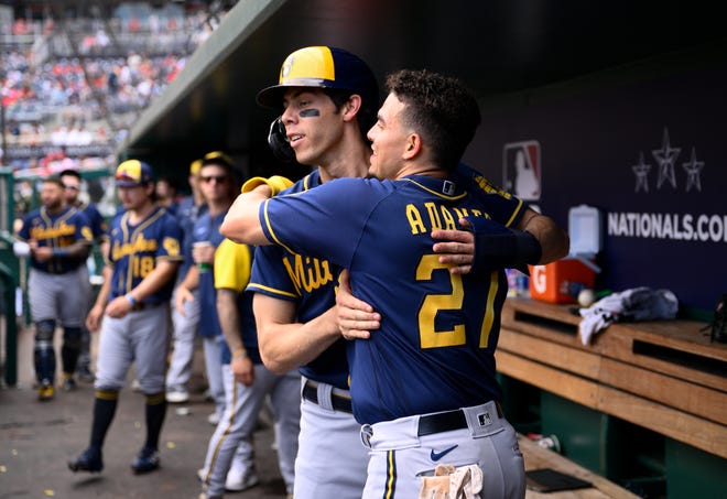 Brewers shortstop Willy Adames gets a hug from Christian Yelich after he belted a two-run home run against the Nationals during the fifth inning Sunday.