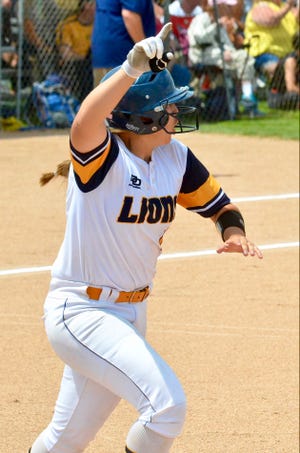 South Lyon's Ava Bradshaw celebrates a home run during the Division 1 softball regional final against Dexter on Saturday, June 11, 2022, at Northville.