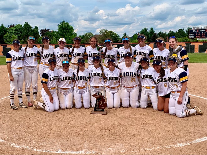 South Lyon celebrates winning the Division 1 softball regional final against Dexter on Saturday, June 11, 2022, at Northville.