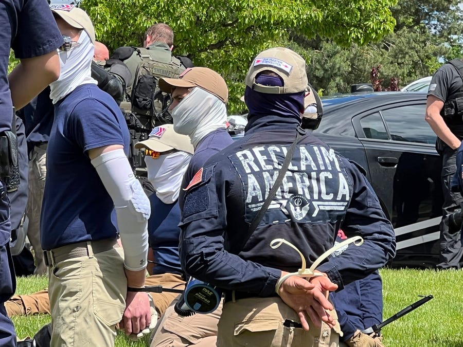Authorities arrest members of the white supremacist group Patriot Front near an Idaho pride event Saturday, June 11, 2022, after they were found packed into the back of a U-Haul truck with riot gear. (Georji Brown via AP) ORG XMIT: LA613