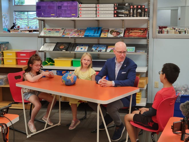 Jeff Arnett, second from left, met with a group of Eanes first graders on his first day as superintendent to ask for tips on how to handle his new job.