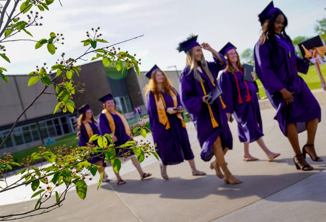 Graduates in the nursing and dental hygiene programs walk the campus during Carl Sandburg College’s 54th Commencement Thursday, May 19, at the Main Campus in Galesburg.