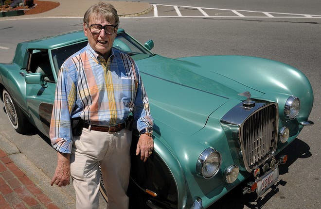Car collector and appraiser Gerry Martel stands next to his Martel Continental, a customized Corvette, on Main Street in Fitchburg Tuesday June 7, 2011. 