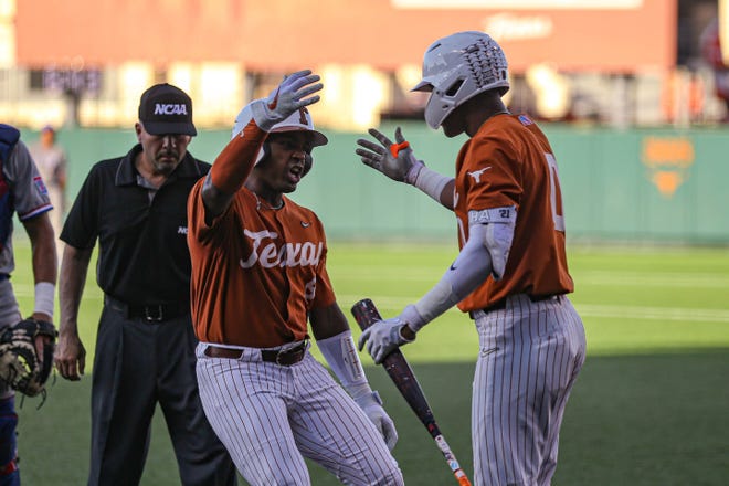 Texas infielders Dylan Campbell (8), left, and Trey Faltine (0) right, celebrate a score against Louisiana Tech in the NCAA regional playoff game at Disch-Falk Field in Austin, Texas on June 4, 2022.

Aem Texas Vs La Tech Ncaa Baseball 8