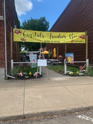 Crystal's Freedom Bee Subs & More at 114 N. Walnut St., Gnadenhutten, has become the latest place to stop for a quick salad, sandwich or dessert. Food is prepared in a trailer. The outdoor dining area features picnic tables with umbrellas, decorative flags and flowers on a 21-by-84 foot lot.