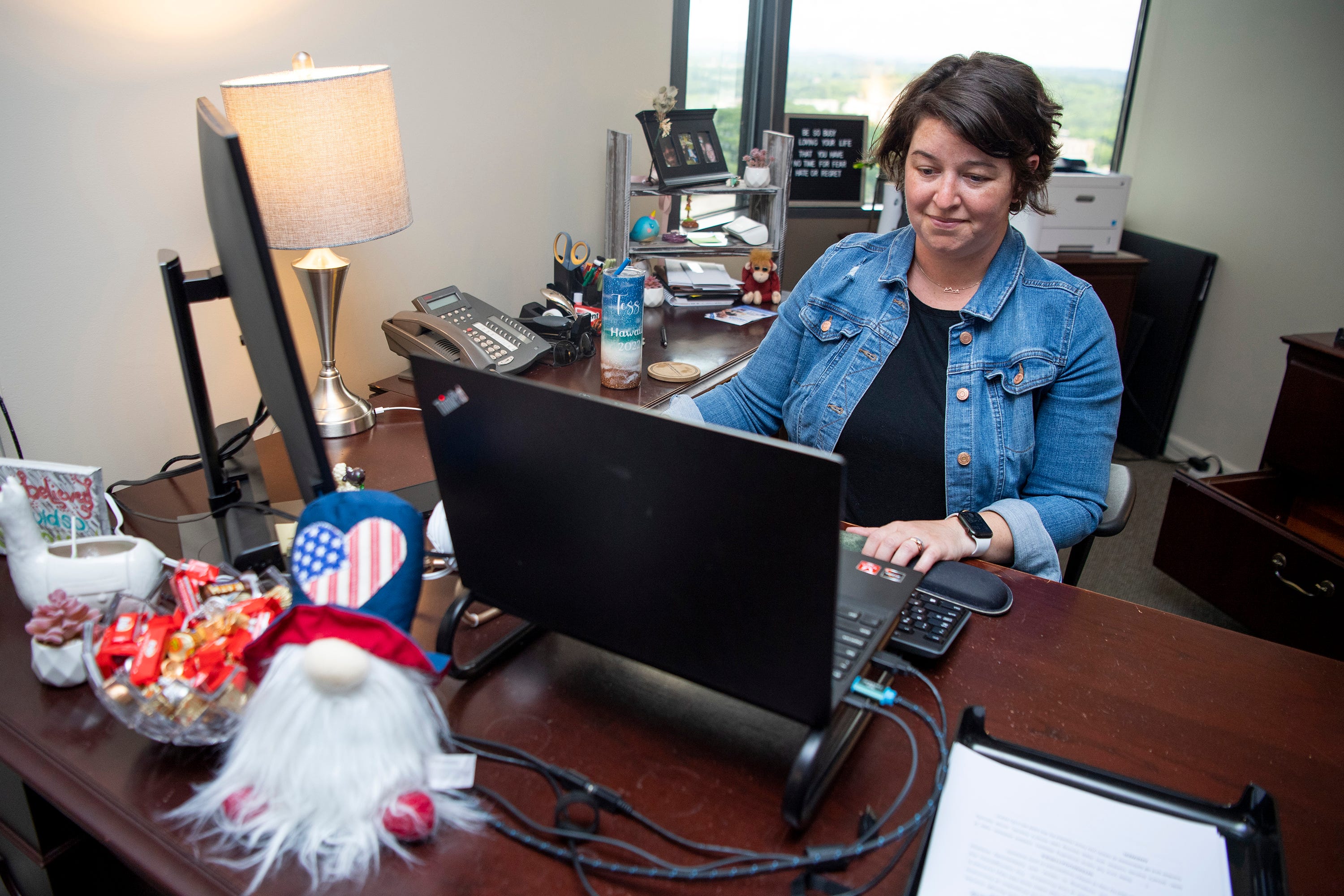 Paralegal Tess Steele works at her desk at Kramer Rayson's downtown Knoxville office on Friday, June 3, 2022.
