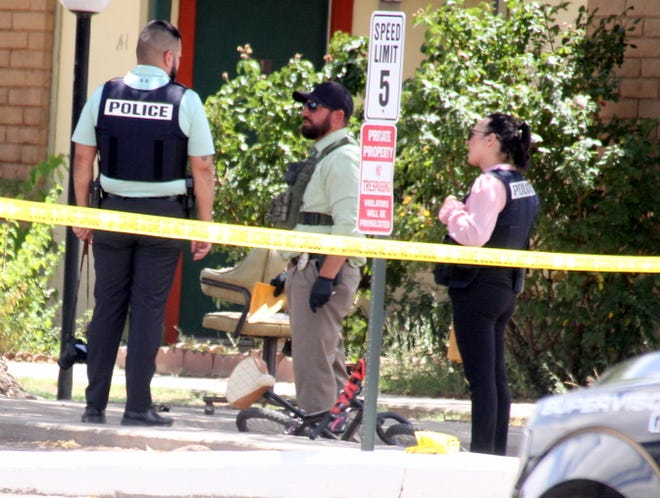 Deming police investigators process the scene of a June 13, 2022 shooting at the Deming Manor Apts.