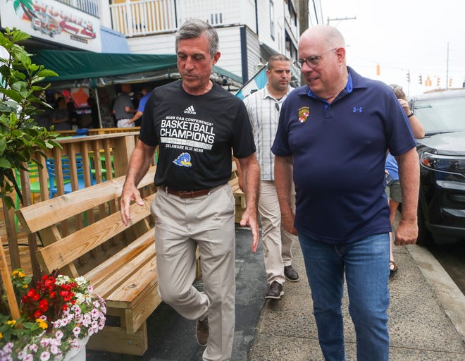 Delaware Governor John Carney (left) and Maryland Gov. Larry Hogan enter Woody's in Dewey Beach as Carney makes good on his NCAA women's basketball tournament wager, hosting a crabcake lunch, Sunday, June 12, 2022.