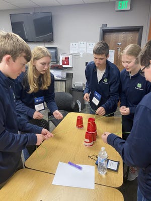 Youth participate in a hand-on activity during the 4-H Leadership Awareness Wednesday event.