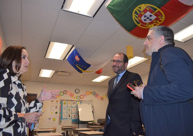 Portuguese Education Minister João Costa (at center) chats with Discovery Language Academy Executive Director Leslie Vicente (at left) and João Caixinha, the Coordinator for the Portuguese Language Programs and Education Affairs in the United States (at right) during a tour to the New Bedford Portuguese school.