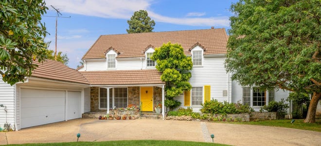 Just sold, the late actress Betty White's unassuming house in the Brentwood neighborhood of Los Angeles has a canary-yellow front door and window shutters.