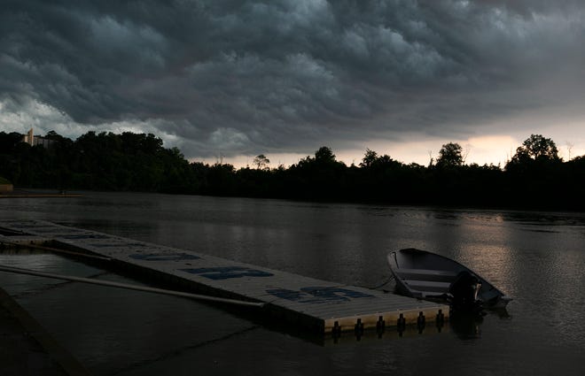 A thunderstorm brings heavy clouds over Winton Lake Monday June 13, 2022. A severe thunderstorm watch is in place in Adams County until 9 p.m. Thursday, June 16, 2022.