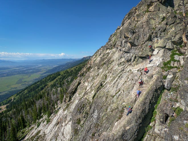 A drone captures an aerial view of via ferrata climbers at Jackson Hole Mountain Resort in Jackson Hole, Wyo.