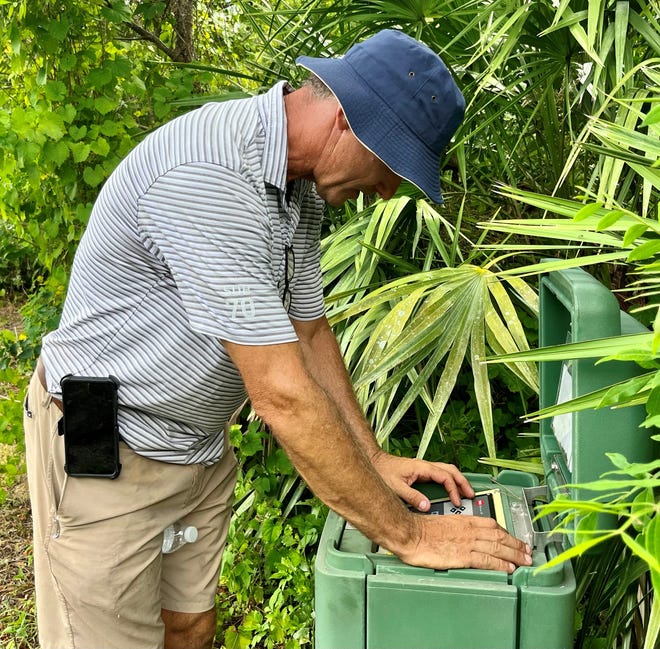 Dan Olsen turns on his irrigation system near the first hole of the University of North Florida Golf Complex. Olsen, who has played in two major championships and on the PGA Tour and Korn Ferry Tour, is overseeing a renovation of the course.