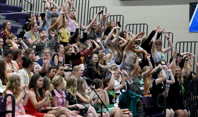 Buckeye Girls State delegates do the wave in June while waiting for a visit from Ohio Gov. Mike DeWine at the University of Mount Union in Alliance.