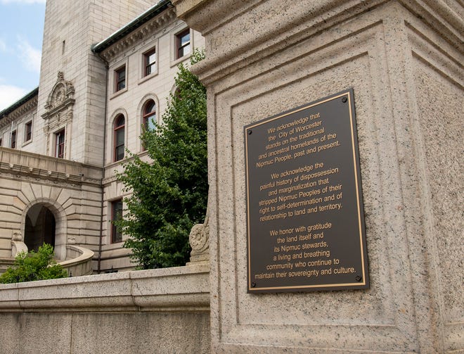A plaque acknowledging Worcester as the ancestral homeland of the Nipmuc People is seen in the front of City Hall