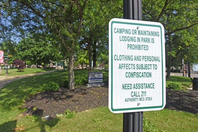 A sign has been placed in Central Park banning camping.