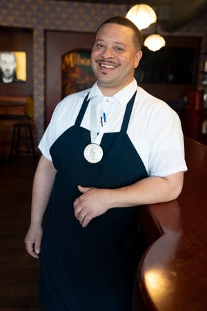 Dane Baldwin, chef/owner of The Diplomat at 815 E. Brady St. in Milwaukee, shows his medal for winning the 2022 James Beard best chef Midwest honor. Baldwin will be among the chefs at the James Beard Chef Invitational.