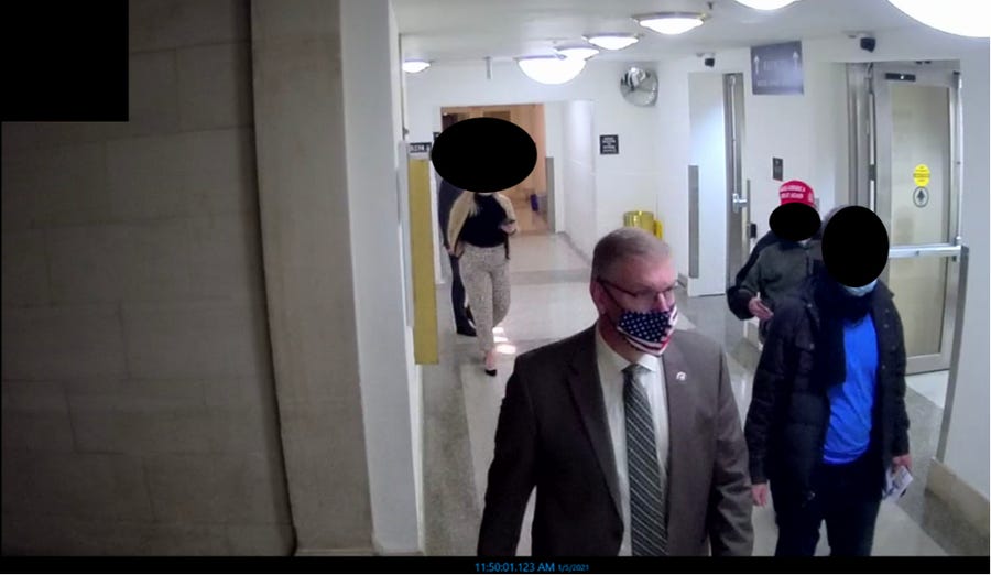 Surveillance footage shows a tour of approximately ten individuals led by Representative Loudermilk to areas in the Rayburn, Longworth, and Cannon House Office Buildings, as well as the entrances to tunnels  leading to the U.S. Capitol on January 5, 2021