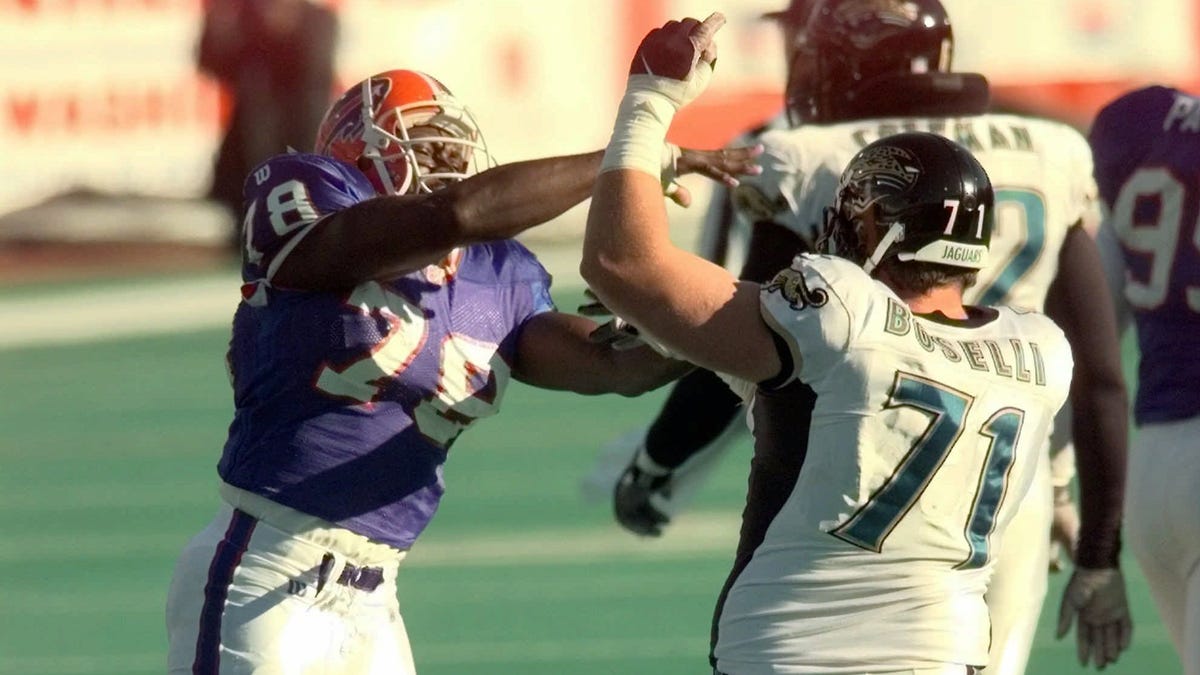 Buffalo Bills DE Bruce Smith and Jacksonville Jaguars OT Tony Boselli (71) shove each other after a play during a 1997 game.