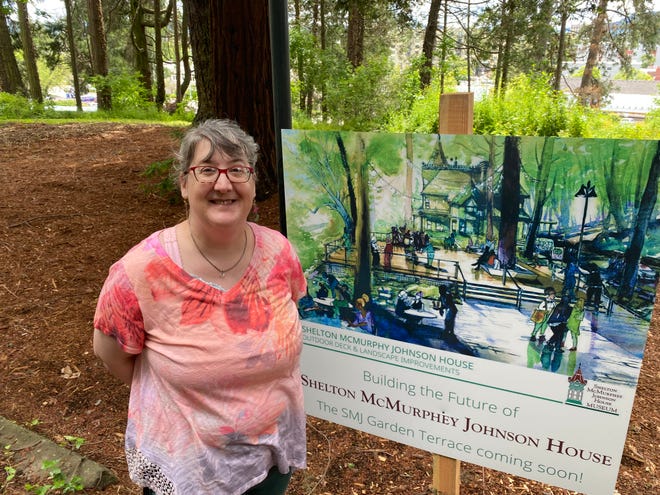 Leah Murray, executive director of the Shelton McMurphy Johnson House, stands at the site of the planned "Garden Terrace" for the shaded area east of the historic building.