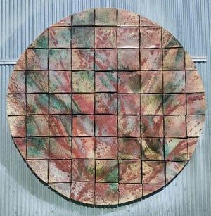 Tom Radca's work includes large ceramic tile pieces for display on walls.