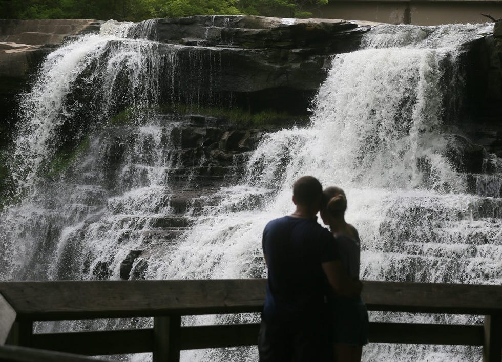 A couple takes in the view of Brandywine Falls in Cuyahoga Valley National Park on June 8, 2021.