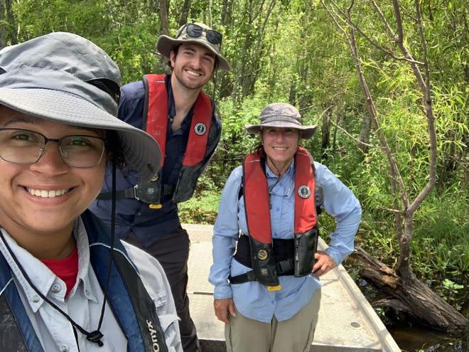 Nicholls State University scientists (from left) Shasta Kamara, Casey Greufe and Delaina LeBlanc stop for a photo during their Limpkin census.